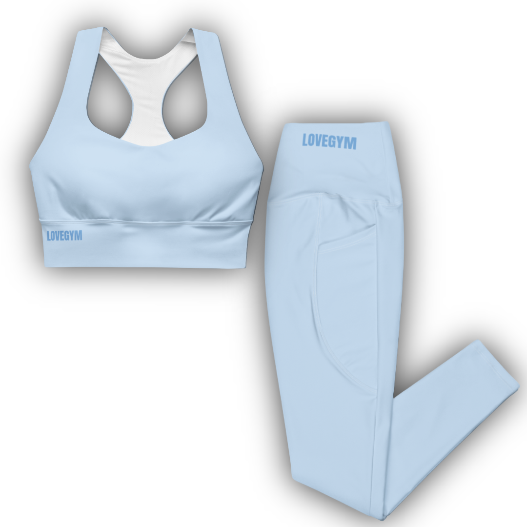 Light blue sports bra and leggings set with 'LOVEGYM' branding on a white background