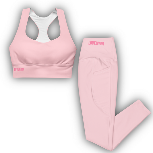 Pink sports bra and leggings set with 'LOVEGYM' branding on a white background