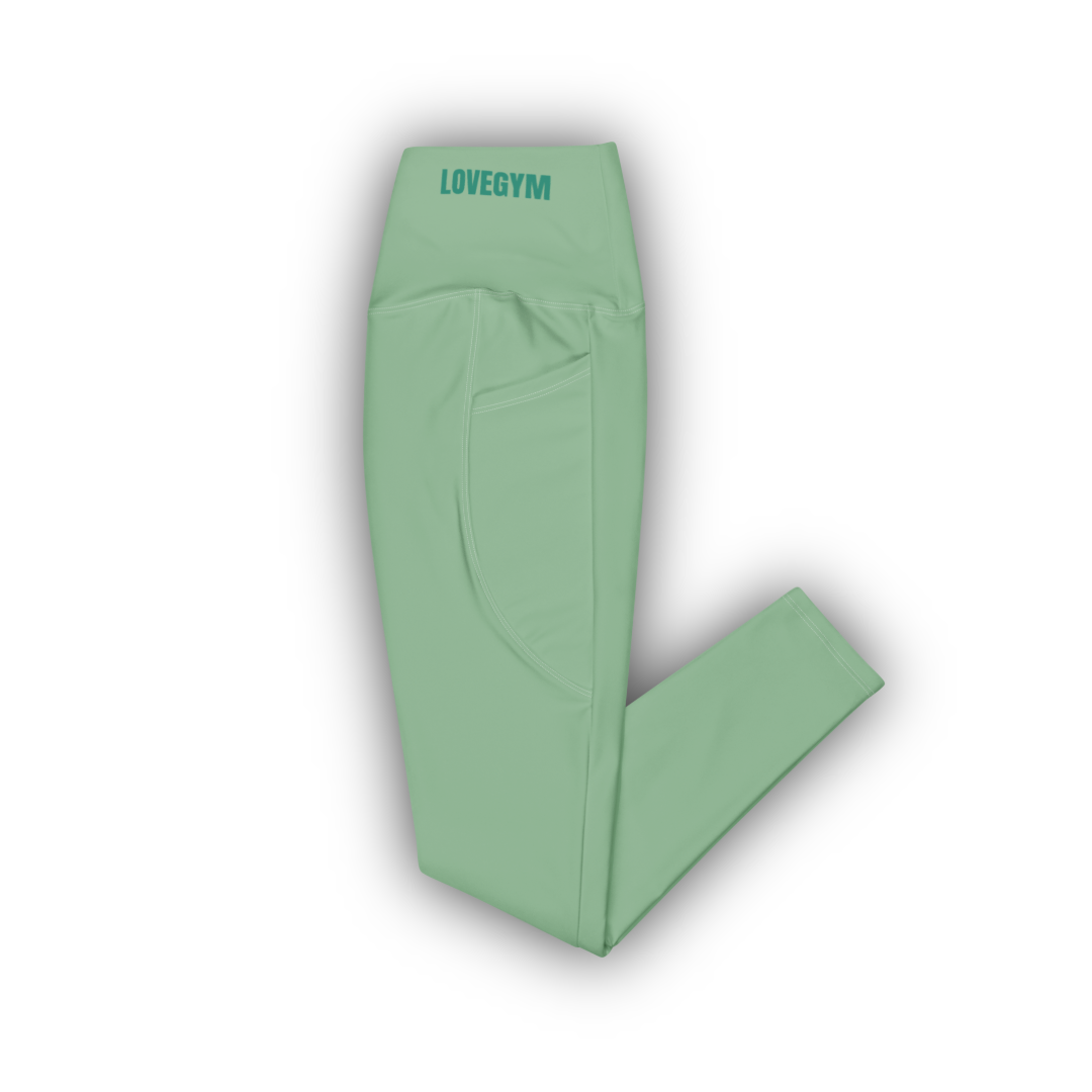 Green leggings with 'LOVEGYM' branding on a white background
